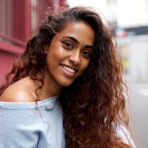 Woman with wavy hair smiling